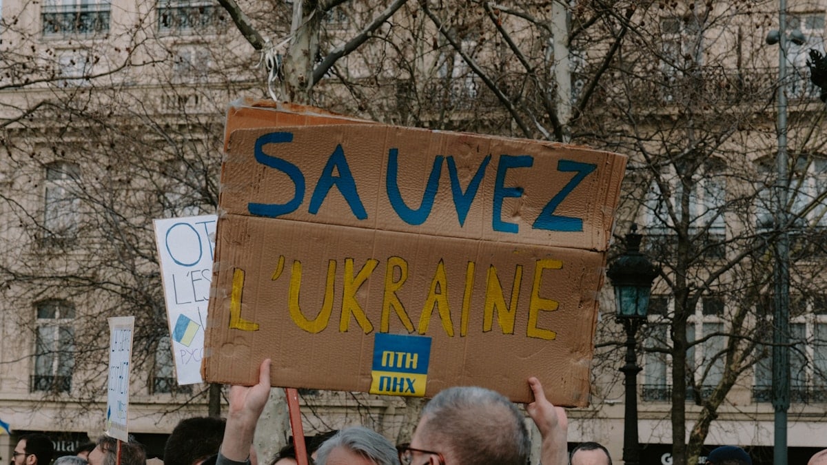 a group of people holding up a sign